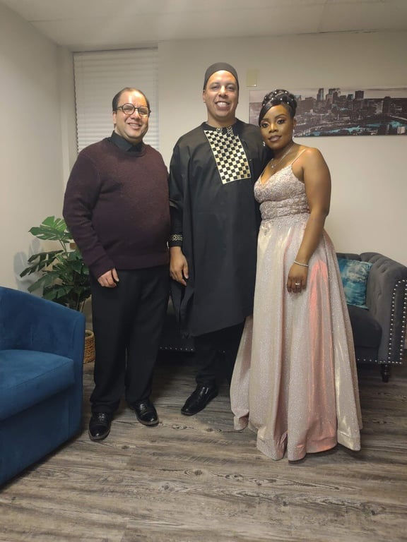 Reverend and couple in Engage Event Center foyer